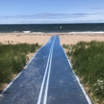 Beach access mat for wheelchair users on the beach